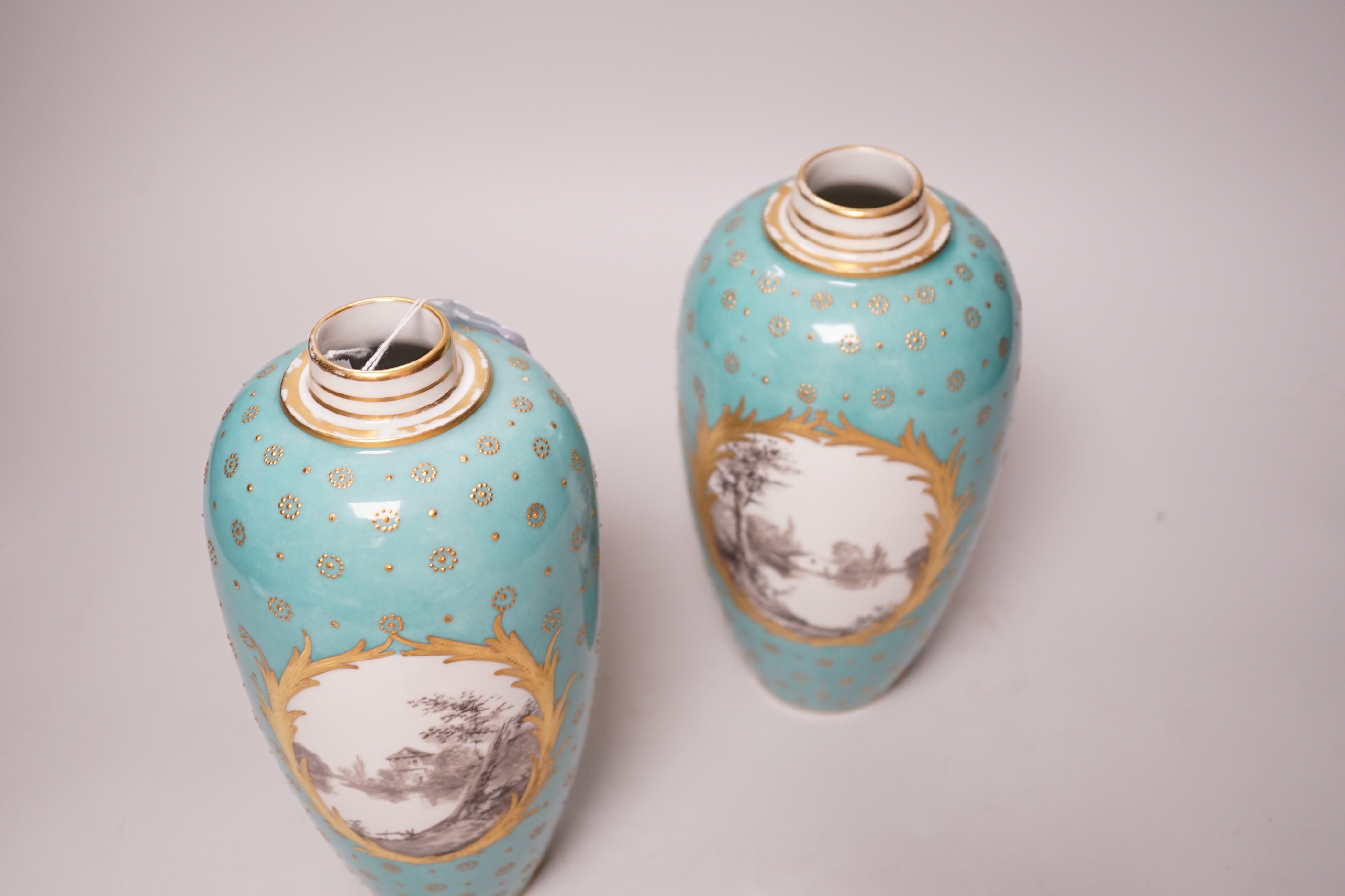 A pair of late 19th century Sevres style turquoise ground vases and covers, 24cm
